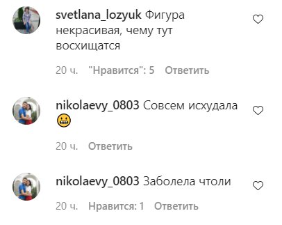 Гимнастка широко раздвигает ноги и показывает бритую пизду во время разминки