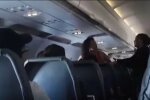 Бійка в літаку, кадр з відео