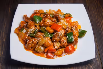 Китайская кухня: свинина в кисло-сладком соусе с ананасами