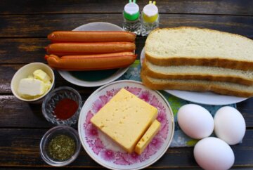 Горячий бутерброд с яйцами, колбасой и сыром