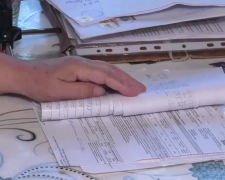 Платіжки за комуналку. Фото: скрін youtube