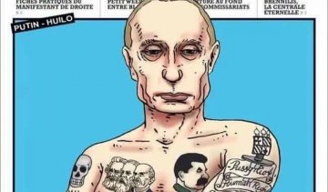 Путіна зобразили з татуюванням Сталіна, Маркса і Енгельса