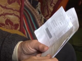 Платежки за коммуналку. Фото: скрин youtube