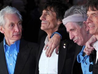 The Rolling Stones в 2012 році. Уоттс - перший ліворуч