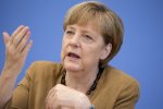 Меркель просит Бундестаг поддержать финансовую помощь Греции