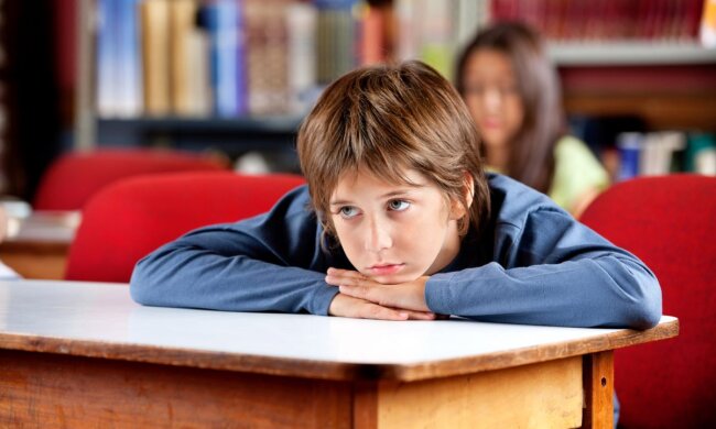 Дитина у школі. Фото: НУШ