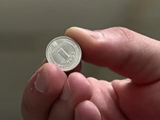 Монета. Фото: скрін youtube