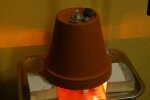 Печка из глиняных горшков, скриншот с видео