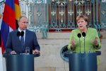 Володимир Путін та Ангела Меркель
