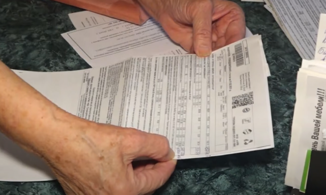 Платіжки за комуналку. Фото: скрін youtube